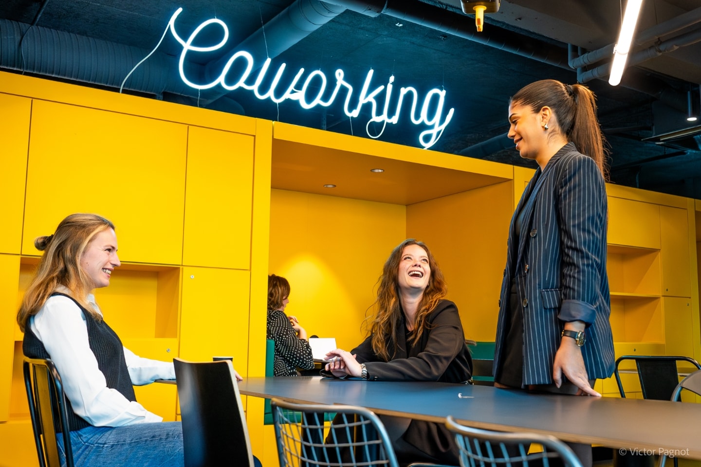 Groupe Pichet coworking space with neon sign